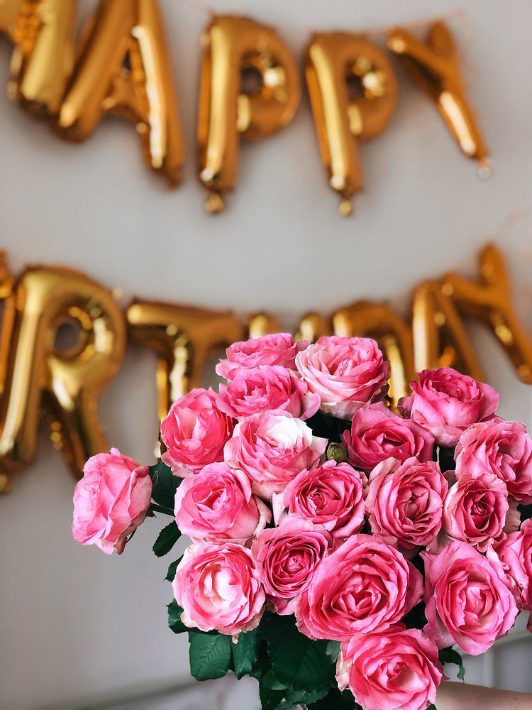 Happy birthday sign with flowers
